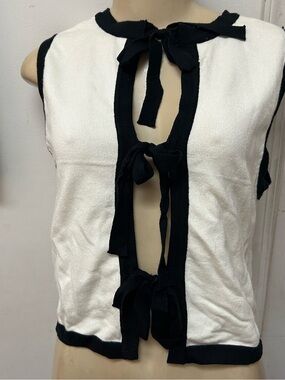 Sleeveless White Knit Top with Black Trim and Front Tie Details